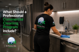 D-Force Janitorial staff cleaning a breakroom counter and sink in a Miami office as part of a commercial cleaning program